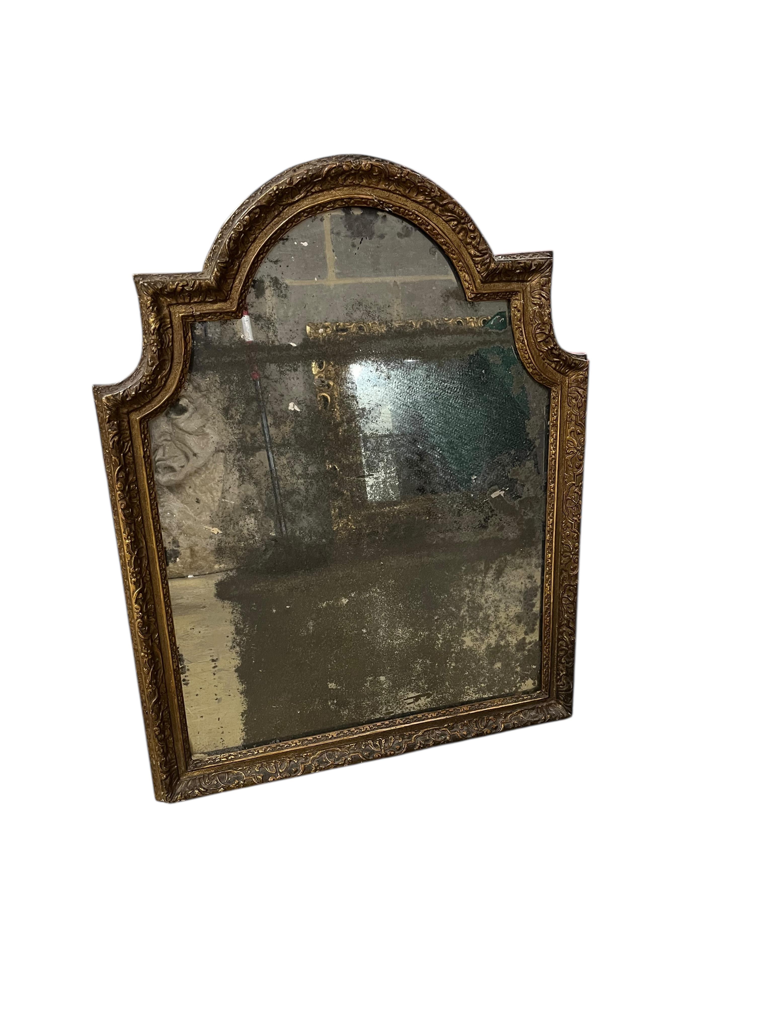 An 18th century carved giltwood wall mirror, width 60cm, height 76cm